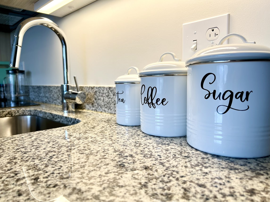 image of kitchen counter with sink and containers